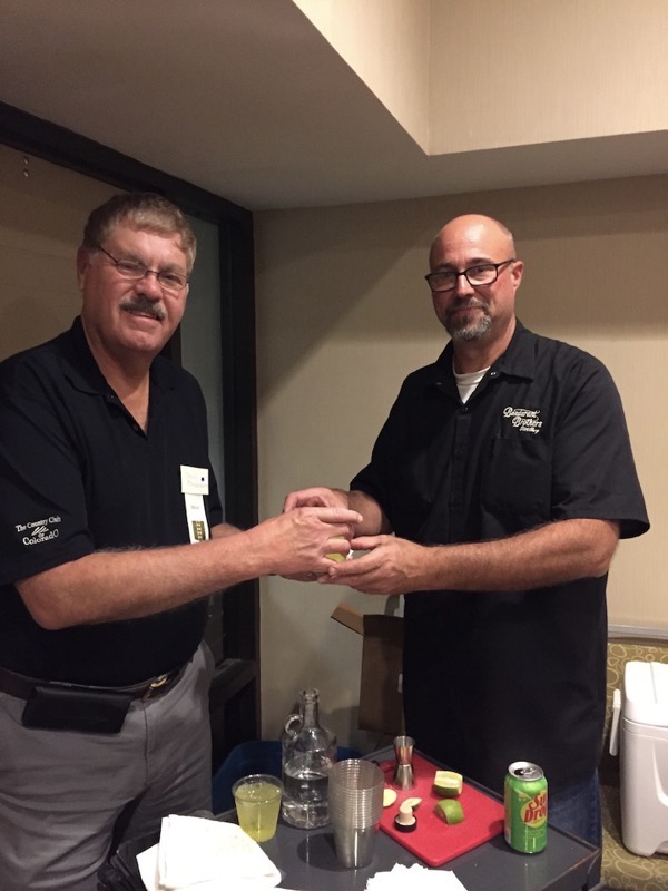 Robert M. Bondurant serves Moonshile Drink to David Bondurant